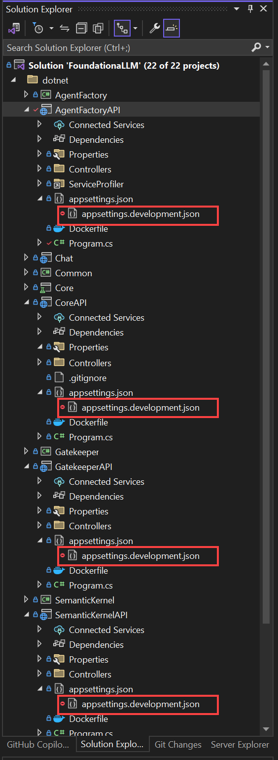 The appsettings.development.json files are displayed in Solution Explorer within Visual Studio.